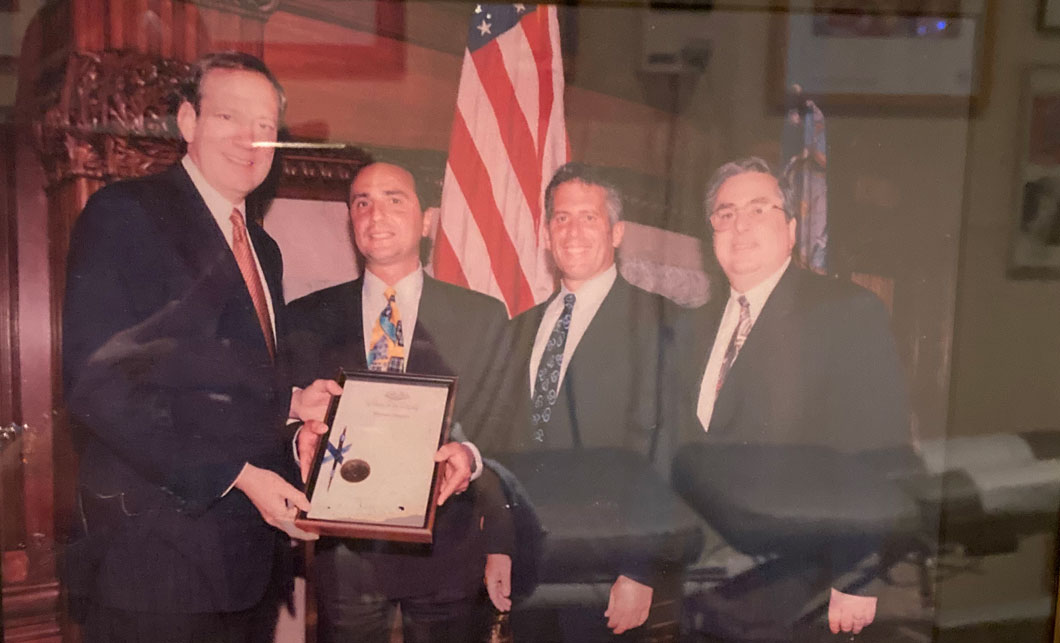 Governor George Pataki signing chiropractic insurance mandate into law